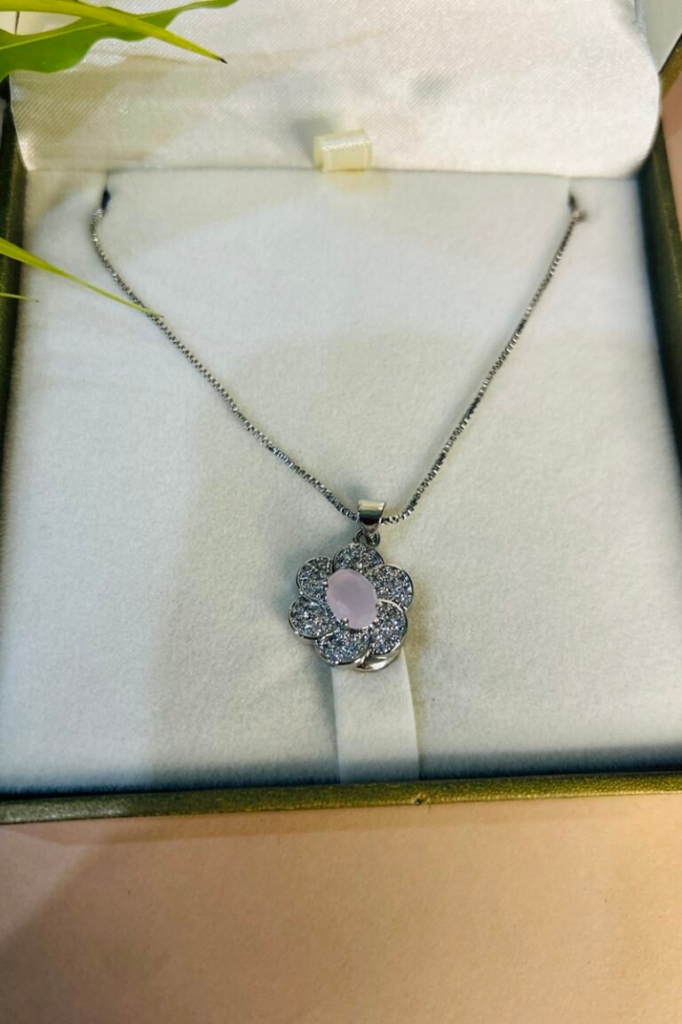 Silver flower locket with white stone