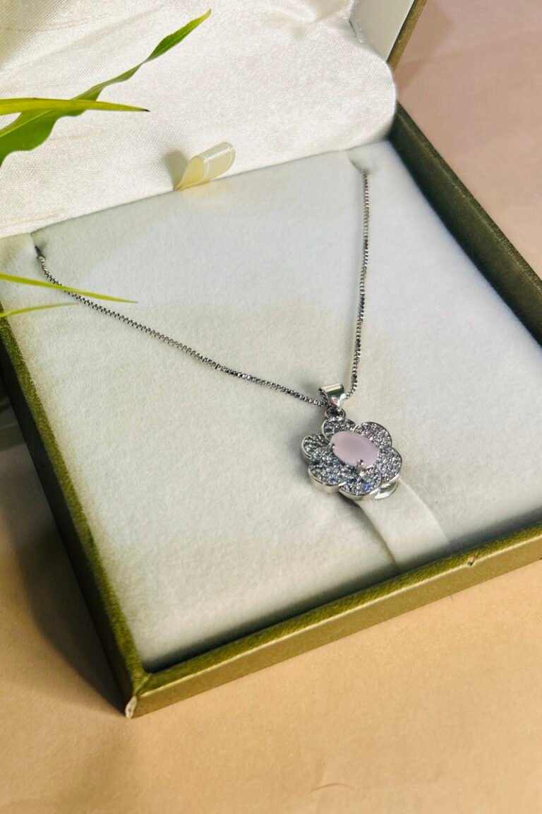 Silver flower locket with white stone