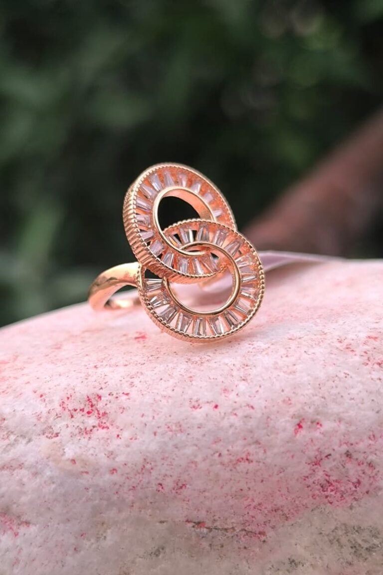 Double round golden ring with white stone