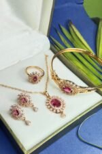 Elegant golden locket set with raspberry pink stone - Image 2